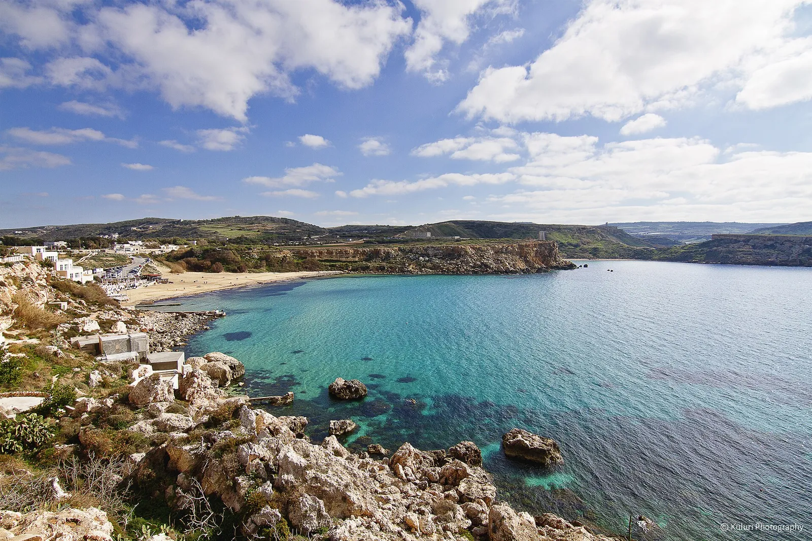 Sand, blue sea and the north-west coastline at Golden Bay.