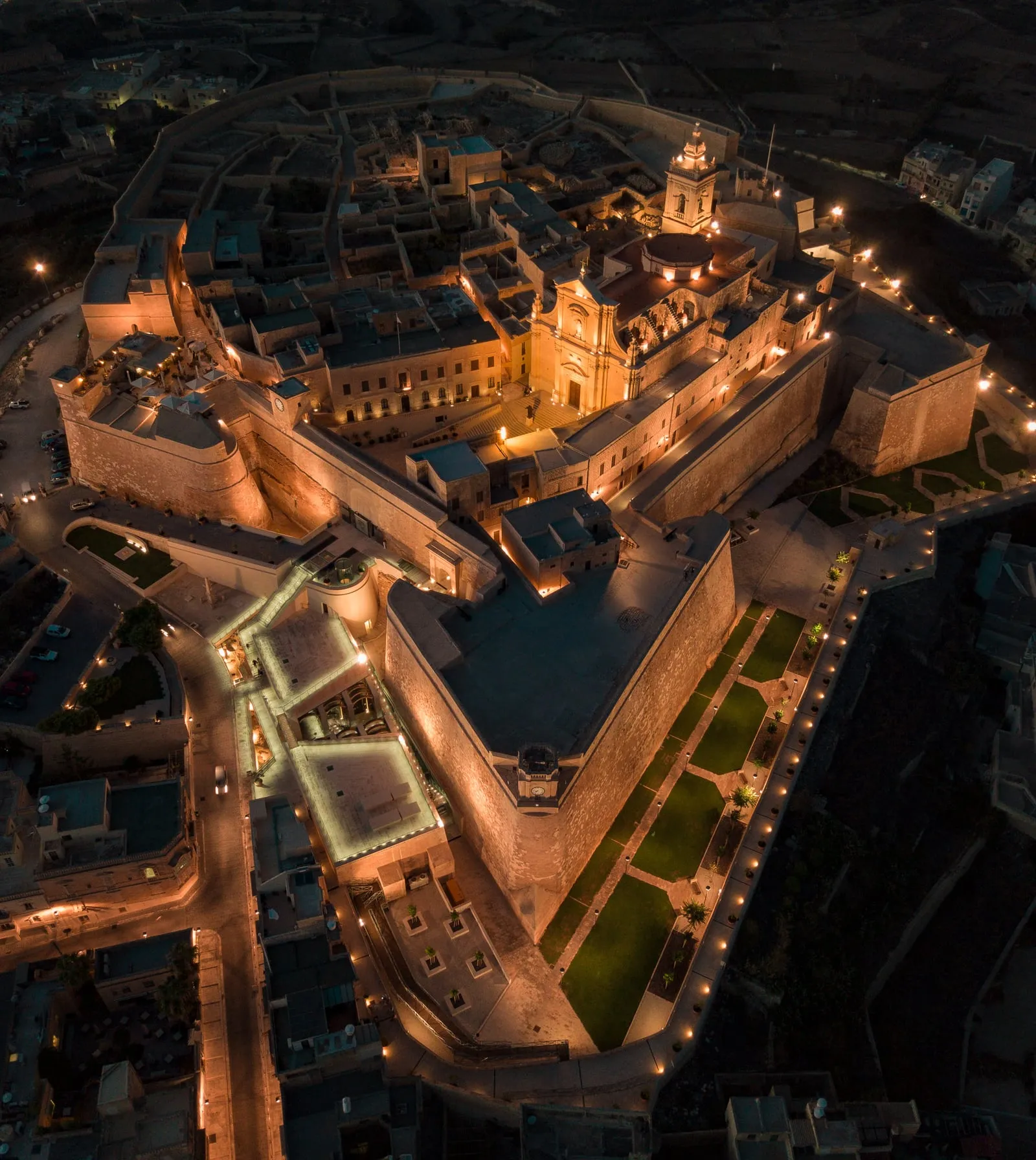 An evening view of the fortified Citadel above Victoria.