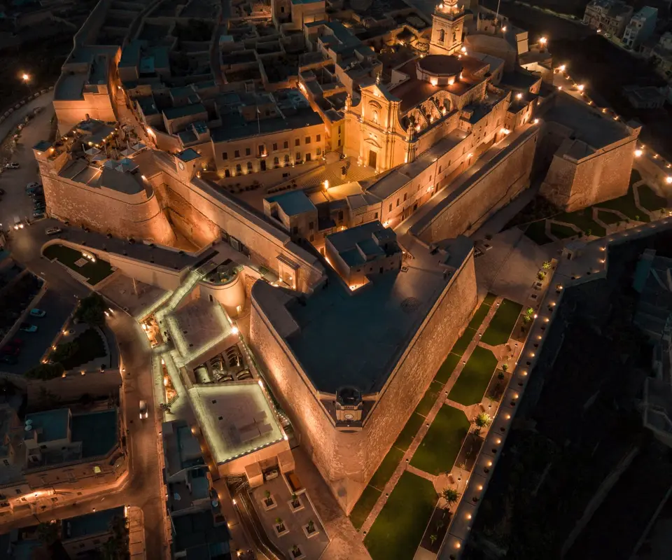 An evening view of the fortified Citadel above Victoria.