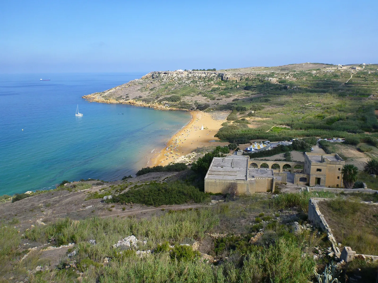Red sand and Mediterranean blue at Ramla Bay.