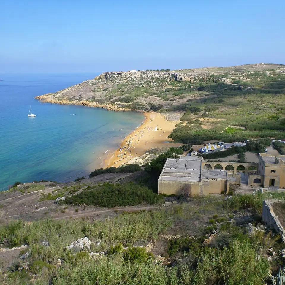 Red sand and Mediterranean blue at Ramla Bay.