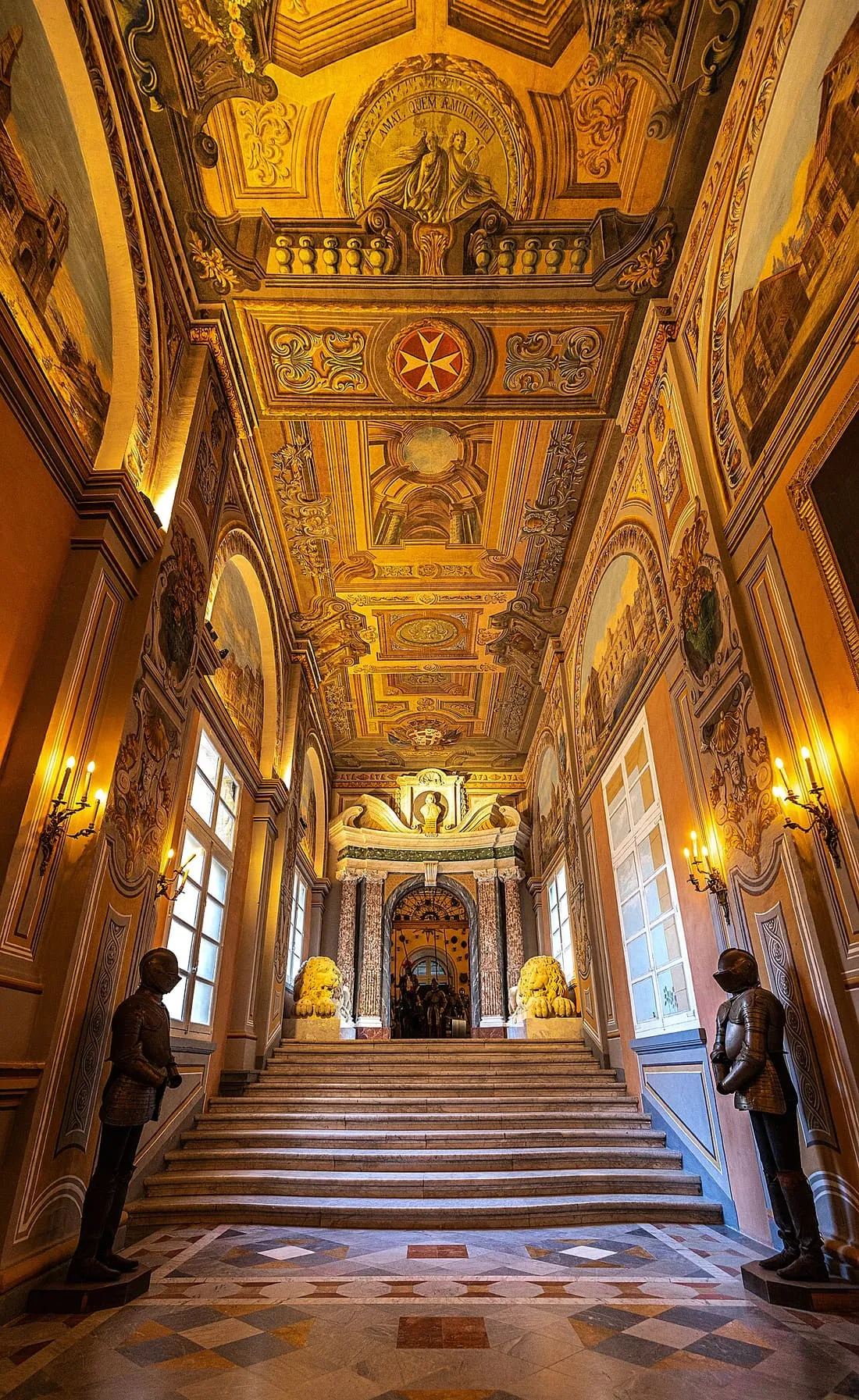 An ornate corridor and painted ceiling inside the Grand Master’s Palace.