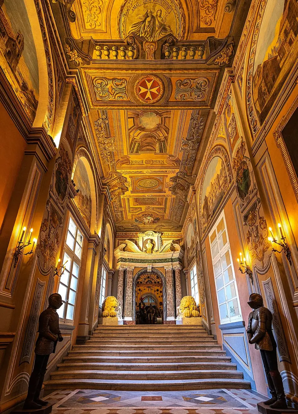 An ornate corridor and painted ceiling inside the Grand Master’s Palace.