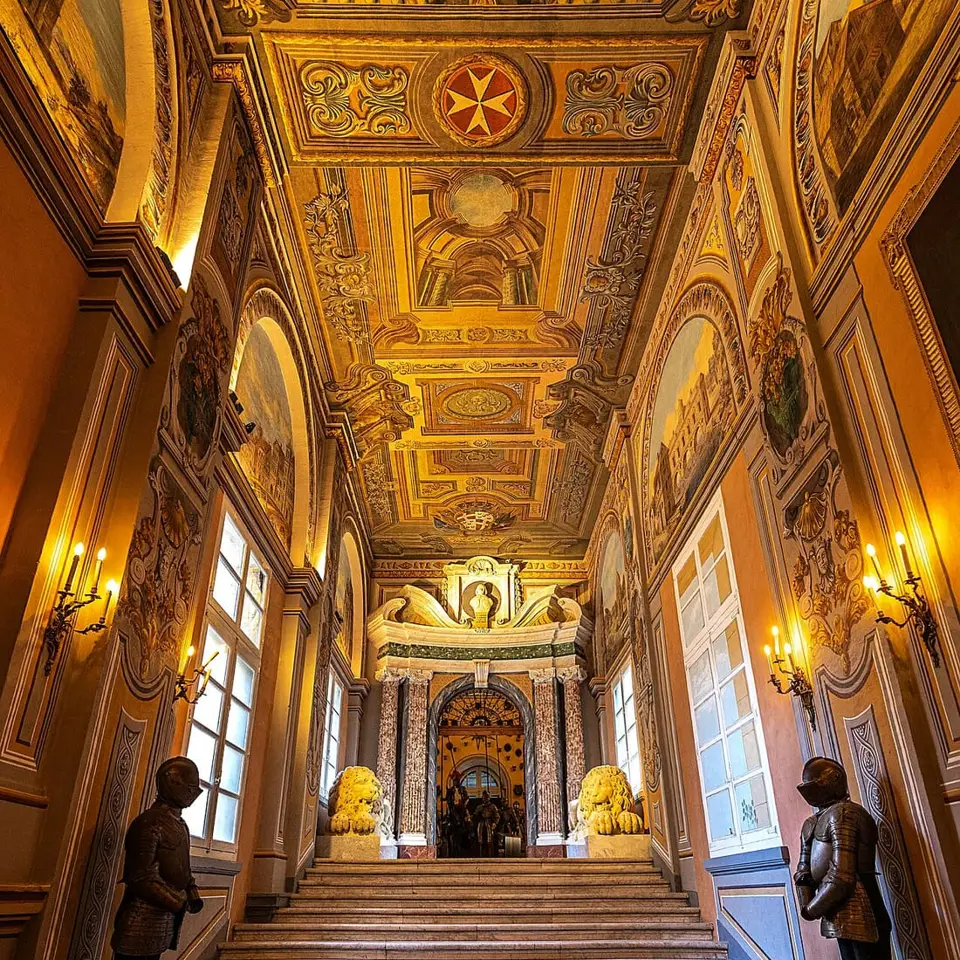 An ornate corridor and painted ceiling inside the Grand Master’s Palace.