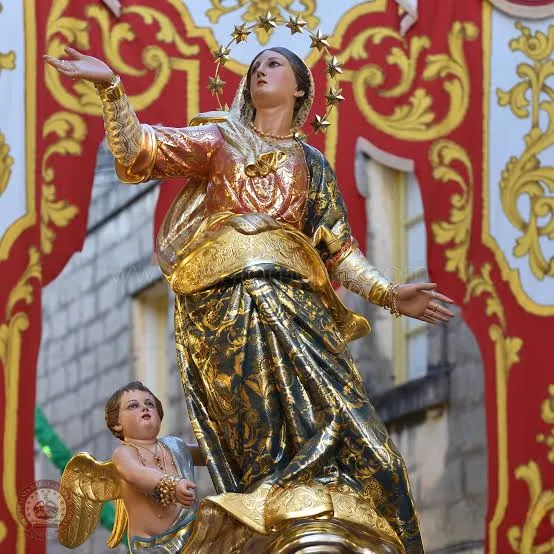 The original Santa Marija statue of Mqabba, photographed among the festa decorations.