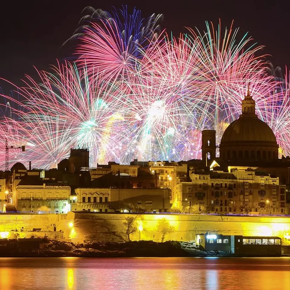 The dome of the Basilica of Our Lady of Mount Carmel, with fireworks lighting Valletta’s skyline.